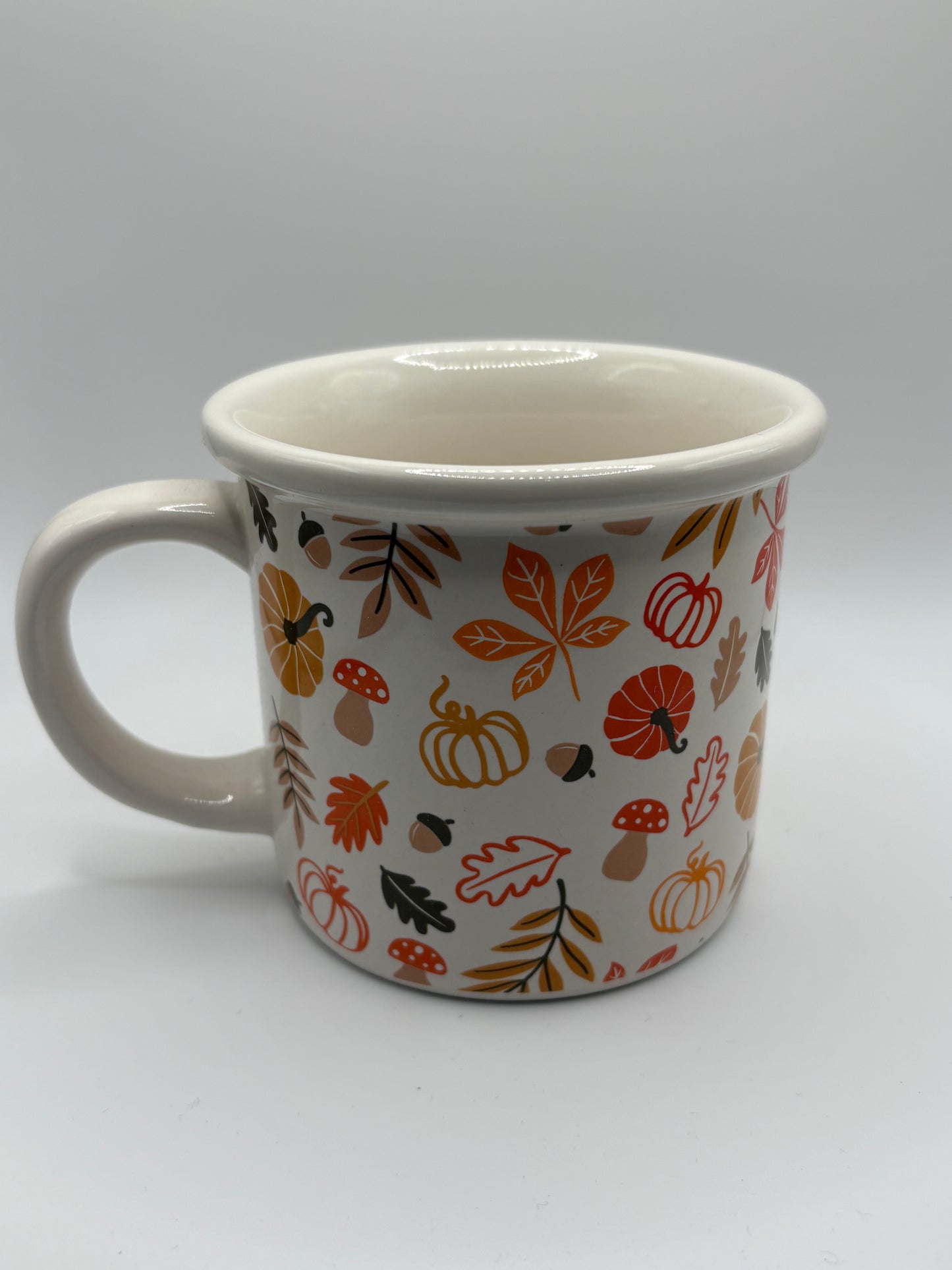 White autumn leaves and pumpkin mug
